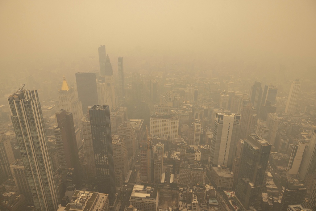 An aerial view shows New York City in a haze-filled sky from the Empire State Building observatory, Wednesday, June. 7, 2023, in New York.
