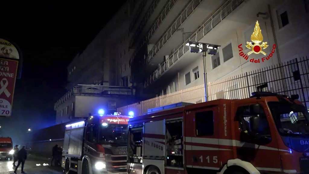 Italian Firefighters vehicles are parked outside the San Giovanni Evangelista Hospital after a fire broke out causing the death of four people in Tivoli, Italy, Friday, Dec. 8, 2023.