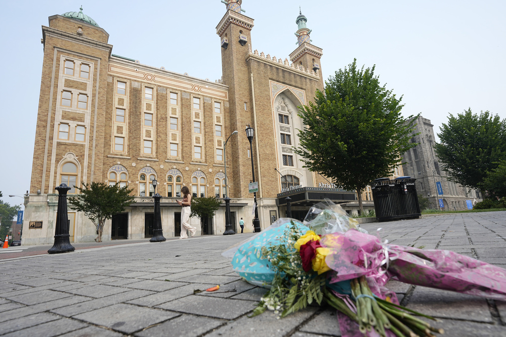 Flowers are placed in front of the Altria Theater which was the site of a mass shooting after a graduation ceremony, Wednesday, June 7, 2023, in Richmond, Va.
