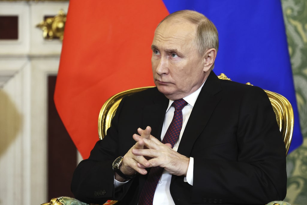 Russian President Vladimir Putin attends a meeting with Iranian President Ebrahim Raisi at the Kremlin in Moscow, Russia, Thursday, Dec. 7, 2023.